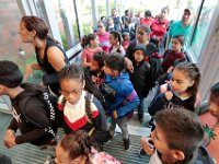 Students rush into the Irwin Jacobs school for their first day of class as students across New Bedford return to school.  [ PETER PEREIRA/THE STANDARD-TIMES/SCMG ]